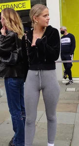 Cute blonde teen wearing grey leggings