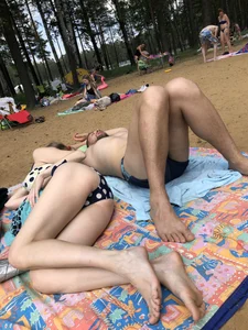 Pale Candid Girl With Thin Legs and Flat Booty Lying on the Beach Creepshot