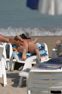 Beach voyeur girls in bikinis, thongs and topless