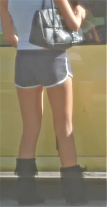 Skinny babe going to her car in little cotton shorts