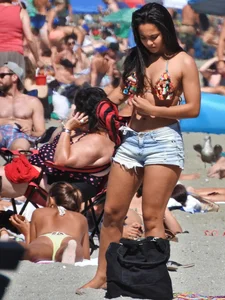 Pretty brunette in a bikini at the beach