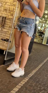 Adorable cute candid teen wearing a top and fringe jean shorts street creepshots, nice tummy and legs