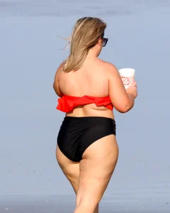 Thick BBW blonde lady in a bikini at the beach