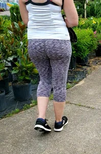 Milf booty in tight leggings shopping for plants