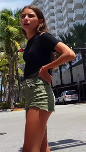 Cute girl wearing shorts and a top at the supermarket