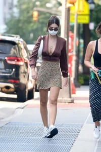 Emily Ratajkowski in mini skirt out for a walk with a friend in New York