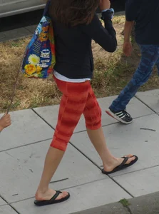 Beautiful brunette teen in orange patterned leggings
