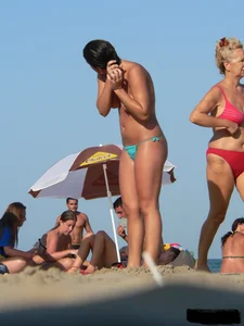 2 topless thonged sexy friends on the beach with great bodies