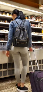 Beautiful brunette shopping in tight grey spandex with a great ass