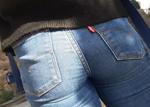 Two beautiful teens in jeans. One white and one blue jeans