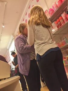 Booty in Black Tights - Girl Bending Over at the Store