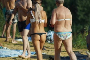 Hot Young Milf in Swimsuit Walking on Sand Beach Photos