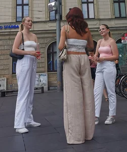 Long blonde braless in a white outfit (many pictures)