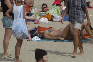 Topless girls on a beach in Barcelona