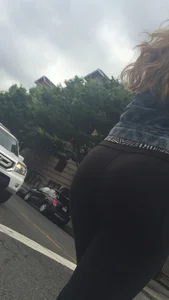 Girl with a nice ass in leggings walking down the street