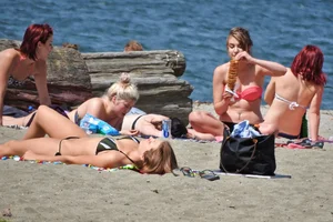 Group of sexy girls in bikinis at the beach