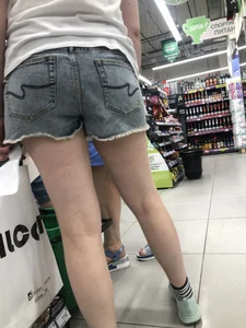 Awkward Candid Teen Girl in Jean Shorts And Sneakers at the Supermarket Creepshots Gallery