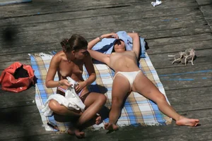 Two teens stripping and going topless to tan