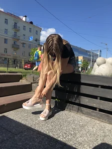 Girl in Denim Shorts with Amazing Hot Legs Fixing Her Sandals Street Candid Photo Gallery