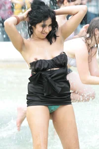 Fountain girl in a skirt accidentally shows her tits and panties