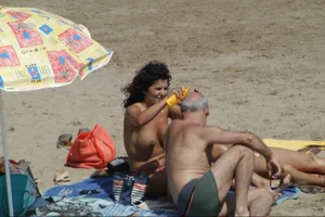 Girls on a nude beach in Sitges, Spain
