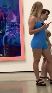 She’s  Blonde in tight blue one piece