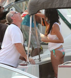 Bikini babe on a boat with a wet see through white shirt showing her tits