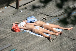 Two teens stripping and going topless to tan