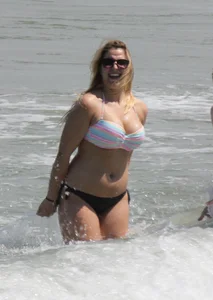 Big boobed thick blonde on the beach in a bikini