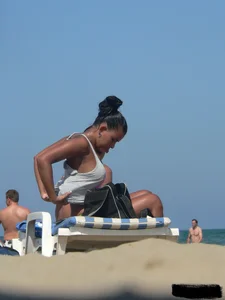 Hot ass topless beach girl with great tits lets her little brother oil up her ass in thong bikini