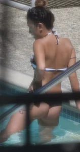 Sexy Asian girl with tattoos in a thong bikini