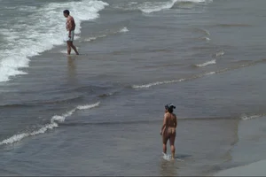 Girls on a nude beach in Sitges, Spain