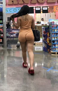 Latina with hard nipples and a big booty in tight spandex shorts outfit