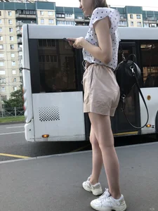 Cute Girl in a Blouse and Shorts With Thin Legs Bus Stop Candid Photo Gallery