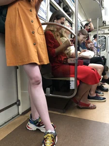 Cute Teen Girl in a Dress With Slim Legs Standing in the Subway Train, Then Crossing the Street Photo Gallery