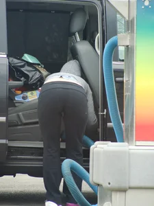 Girls cleaning their cars in jeans and pants