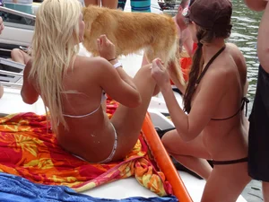 Party girls looking sexy out on boats in bikinis