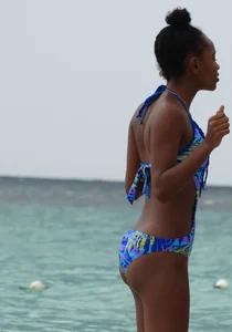 Candid black family, milf and teens on the beach in bikinis