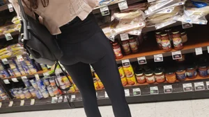 Cute butt in shiny black leggings