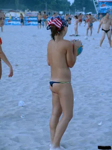 A bunch of sexy beach voyeur babes in bikinis, thongs and topless