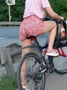 Girl with Hot Legs and Booty in Shorts on the Bike Street Candid Closeup