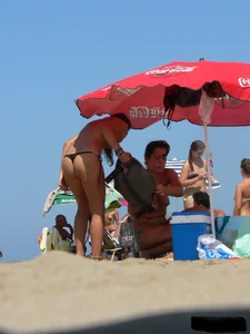 2 topless thonged sexy friends on the beach with great bodies