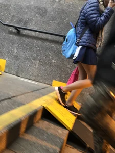 Girl With Skinny Legs in Pahtyhose and a Skirt Walking Down the Stairs Street Candid Gallery