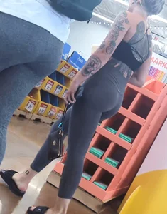 Tight ass in spandex with back Tattoo