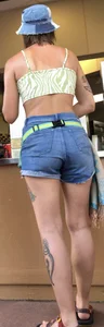 Tatted up hippie in short jean shorts with a nip slip