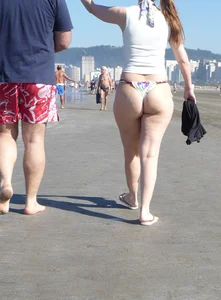Big booty beach babe in thong bikini
