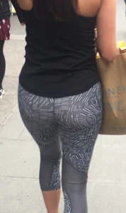 Sexy girl walking in grey patterned leggings with friend in tight jeans