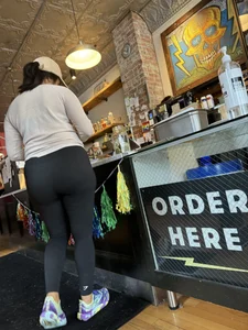 Big ass girl In tights at cafe