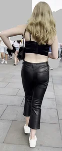 Sexy blonde in tight shiny jeans and croptop