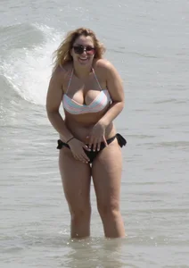 Big boobed thick blonde on the beach in a bikini